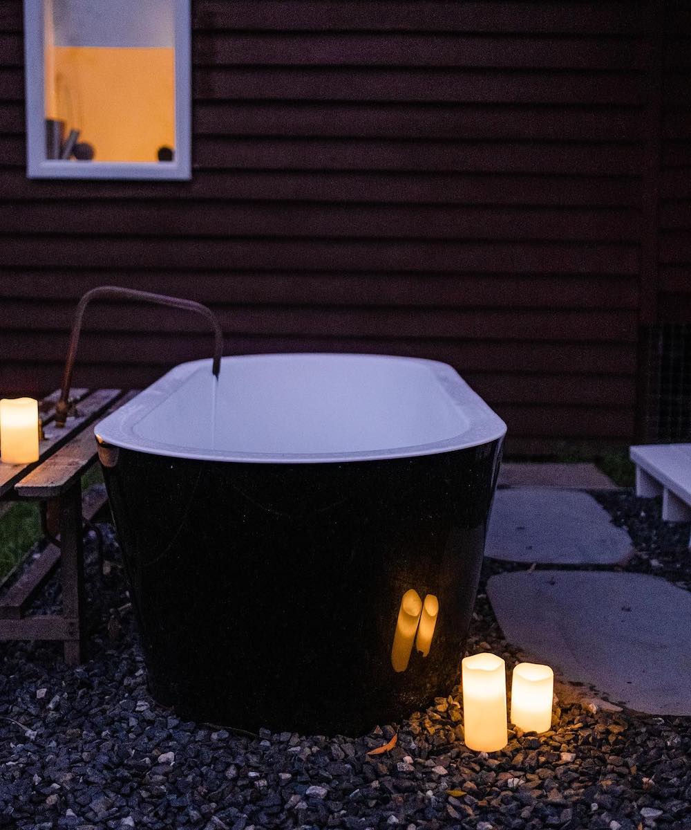 An outdoor bath with candles
