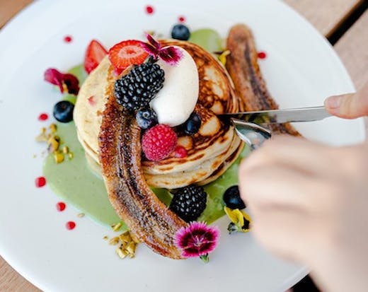 a stack of pancakes from Mimosa