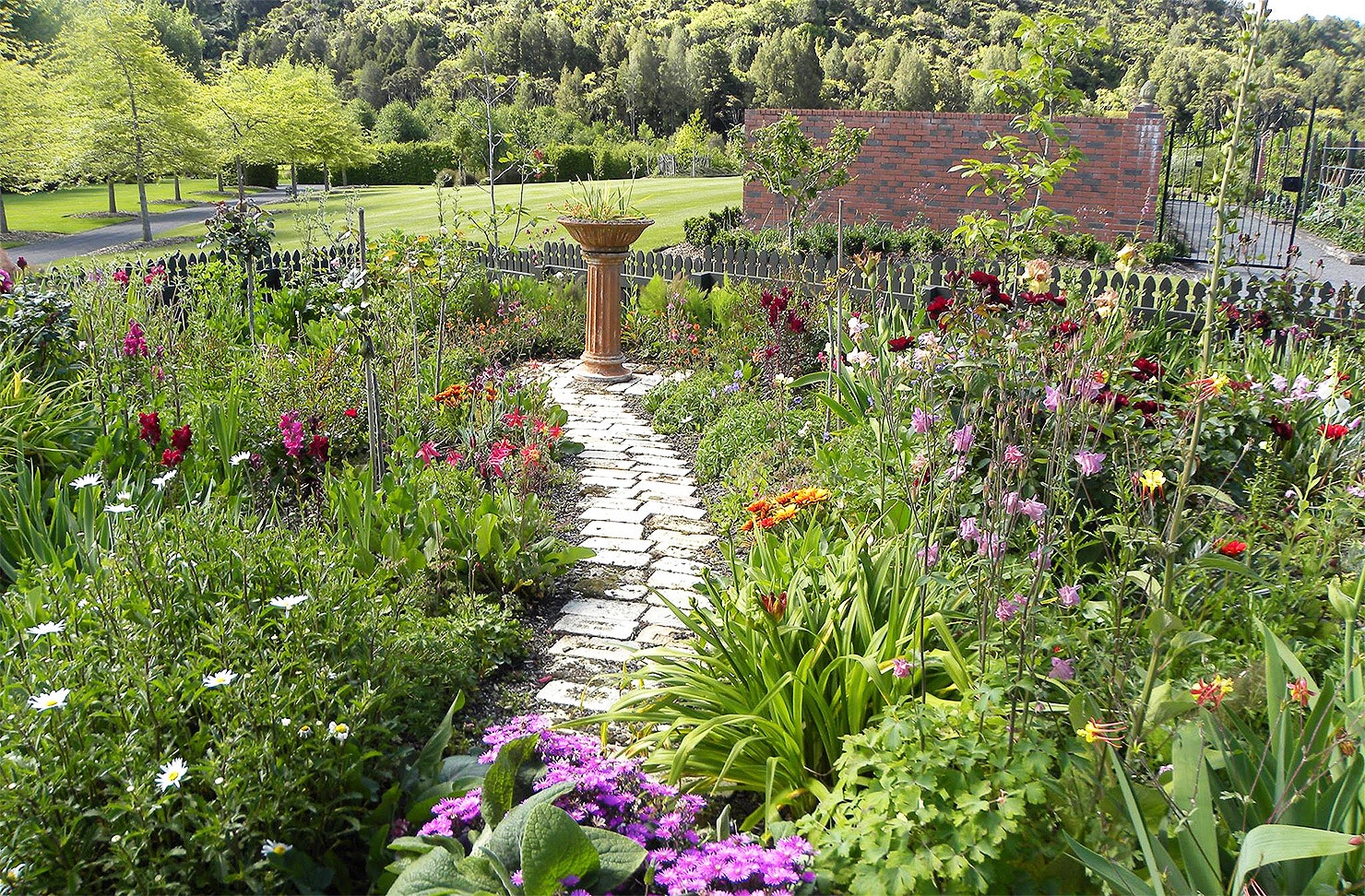 A pretty path winds its way along between flowers