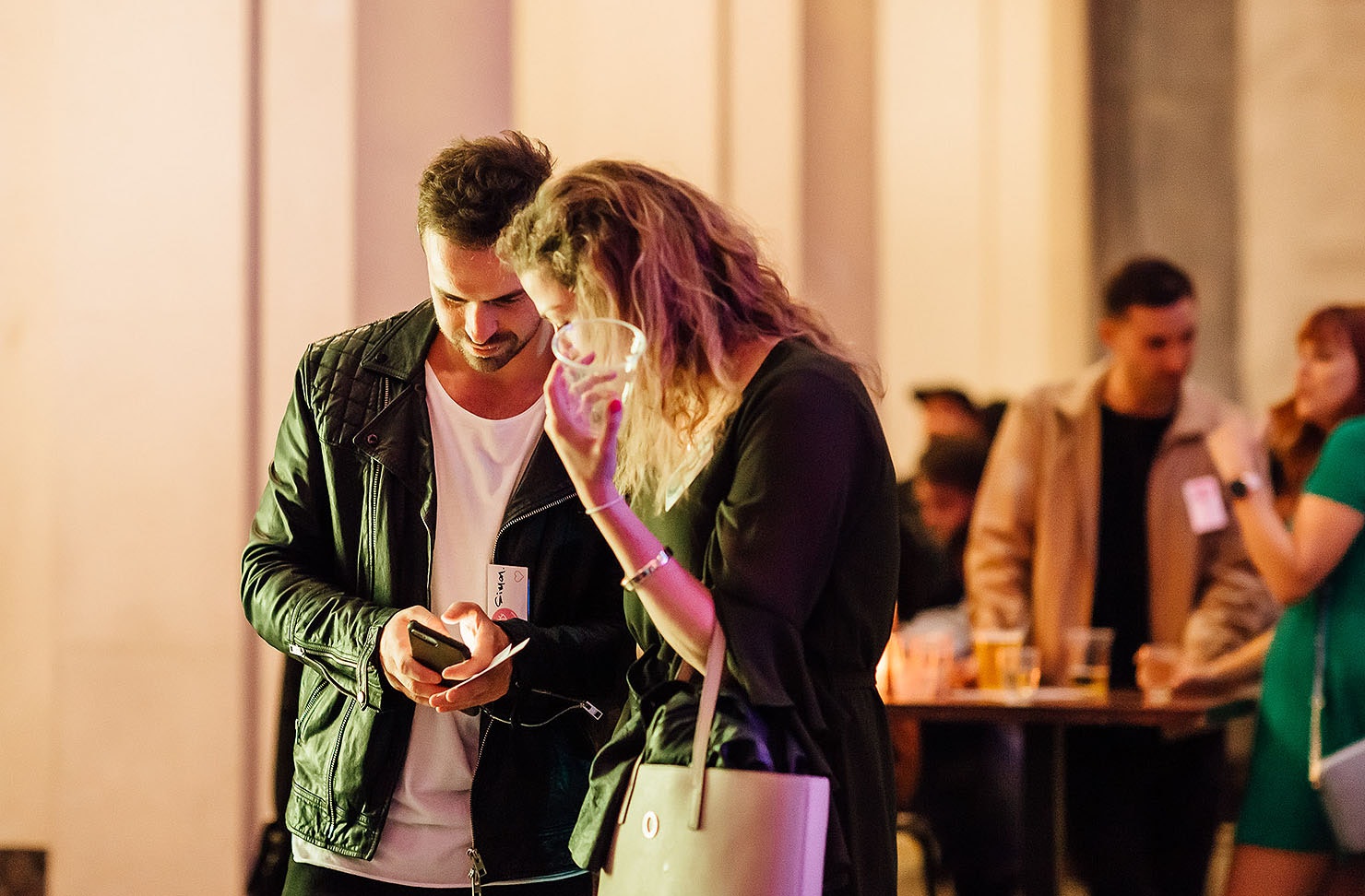 A man and woman ponder over a puzzle at the museum's singles night.