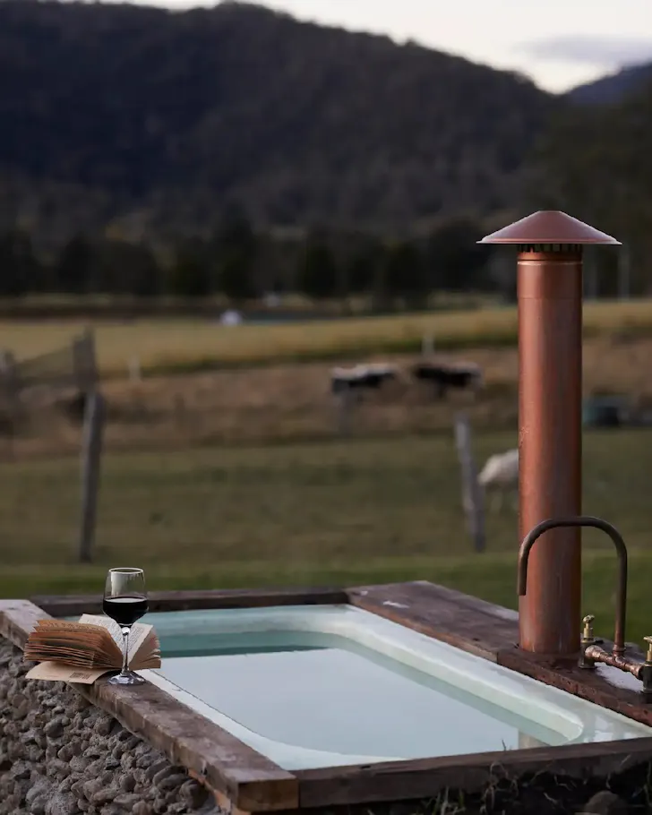 The outdoor bath overlooking fields at Misty Ridge Airbnb bear Brisbane Queensland