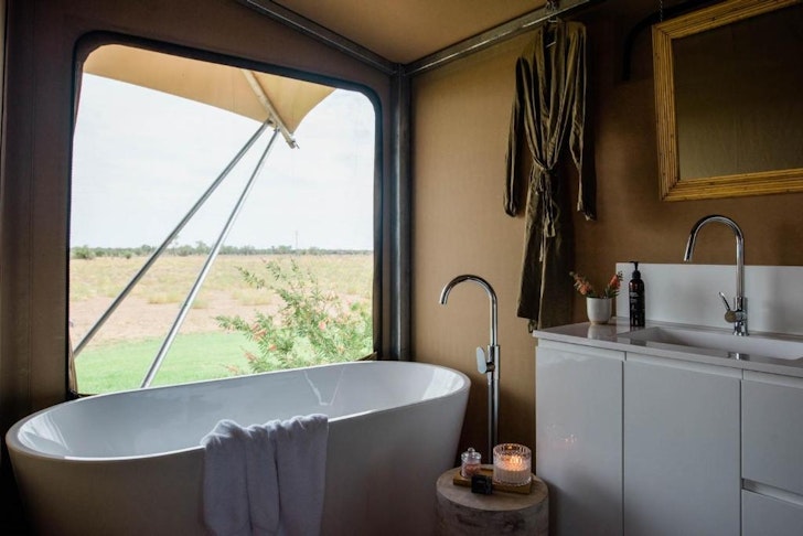 A bath inside one of the tents at Mitchell Grass Retreat one of the best glamping spots in Queensland