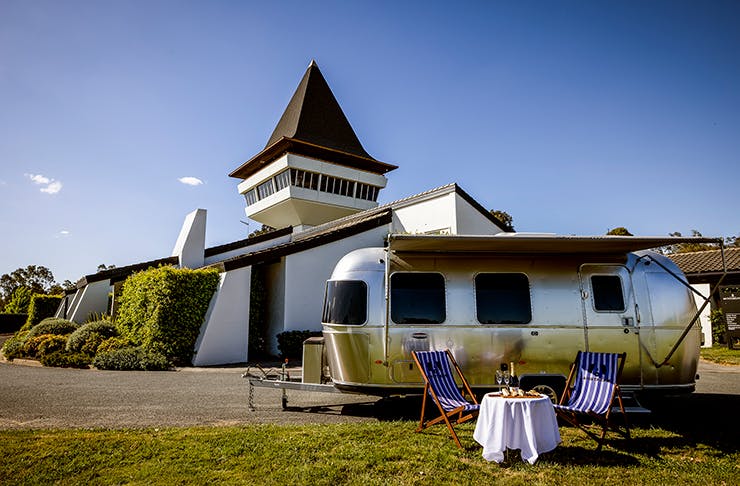 An airstream in front of a winery.