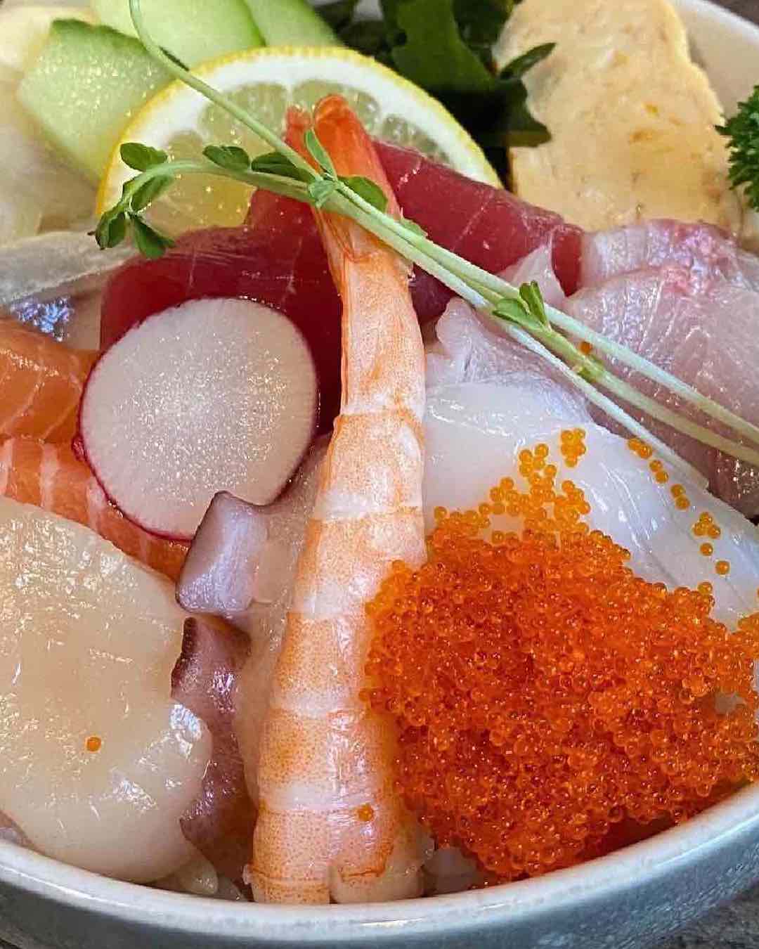 a bowl of sashimi 