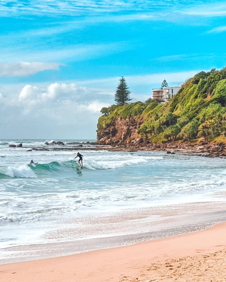 a long surfer on the break at Moffat Beach Sunshine Coast