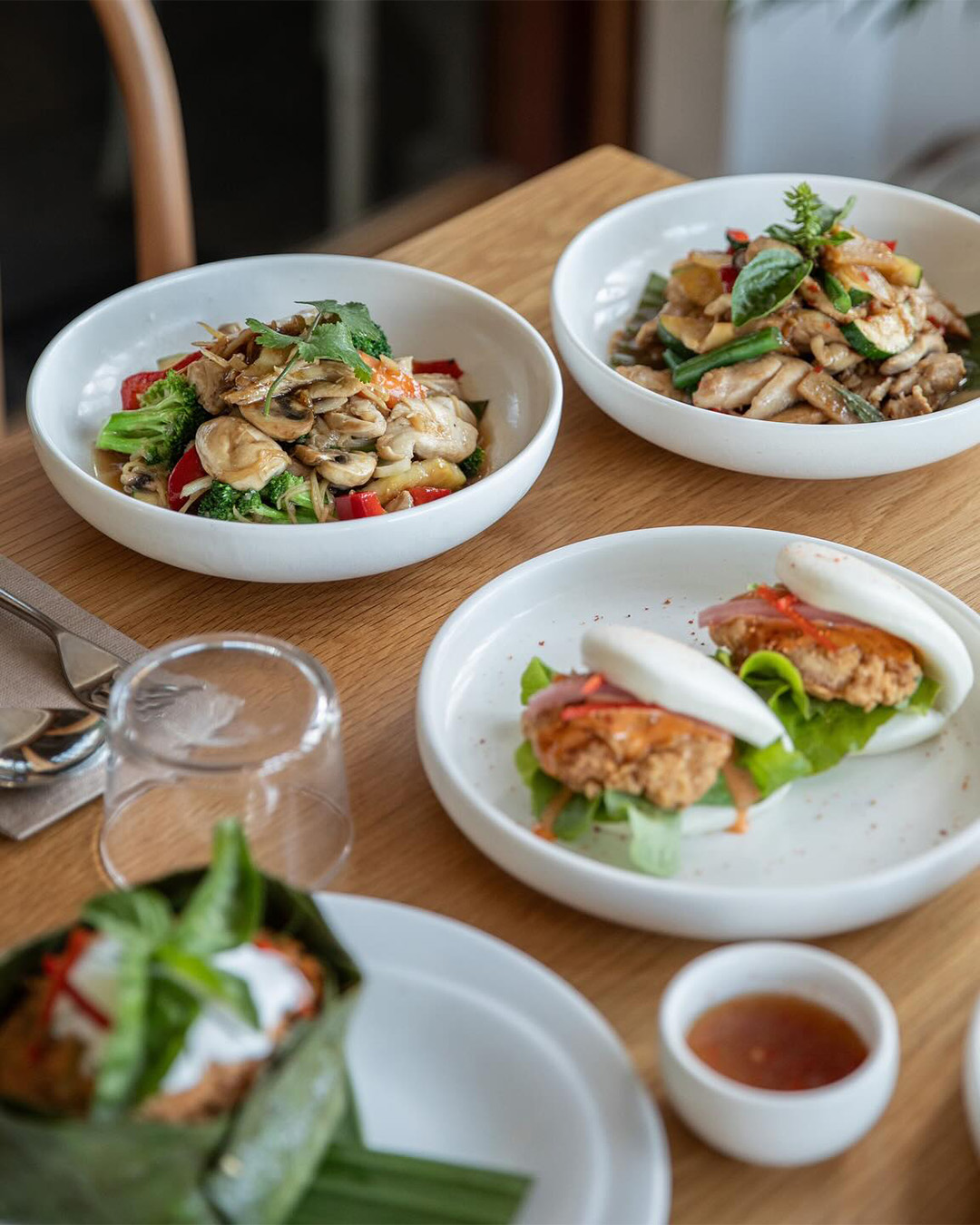 plates of food at Mons Thai restaurant in Brisbane