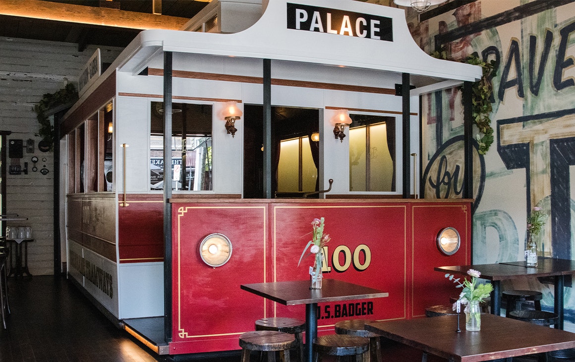 a large red tram inside a restaurant