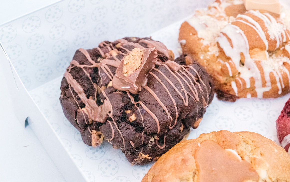 a chunky chocolate cookie topped with reeses pieces