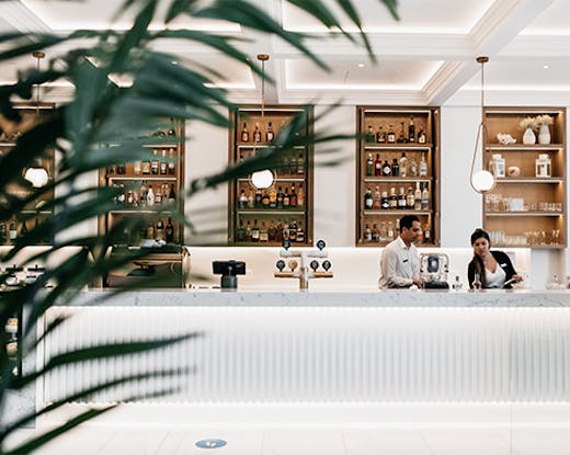 The sleek, white interior and gleaming bar of Ms Margot in Surfers Paradise.