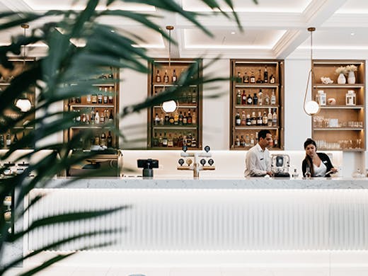 The sleek, white interior and gleaming bar of Ms Margot in Surfers Paradise.