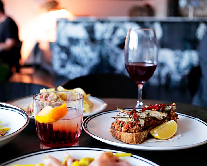 A selection of share dishes, a negroni and glass of red wine at Mummucc'