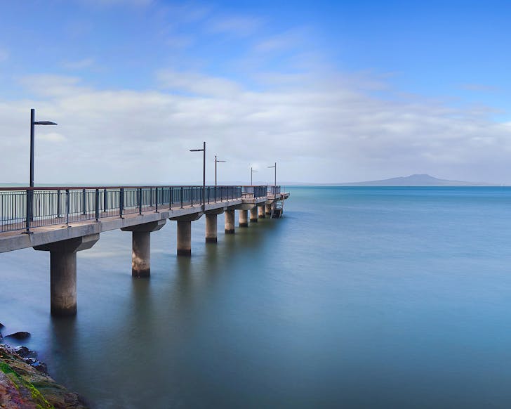 Murrays Bay Wharf extends into the sea.