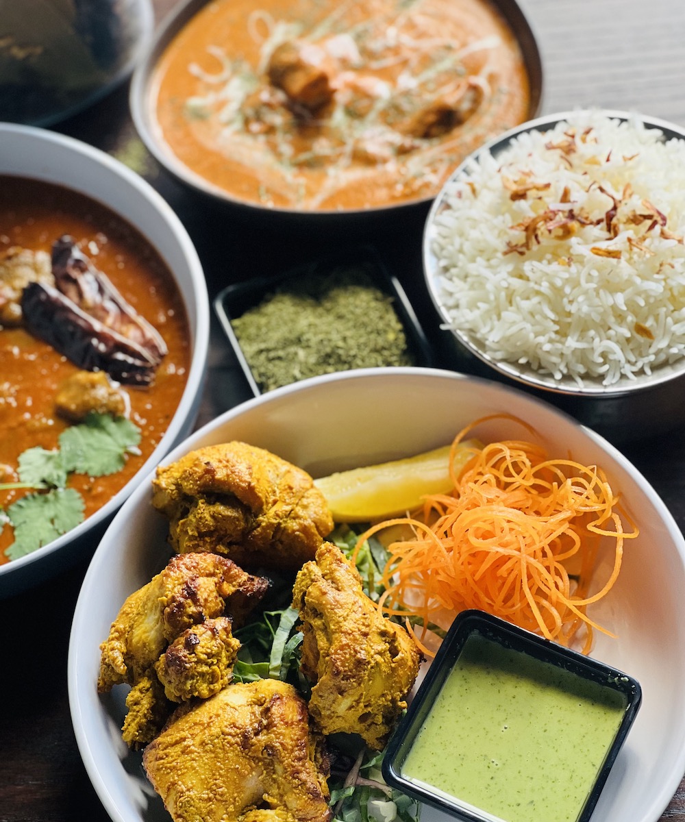 Indian dishes on a table with rice
