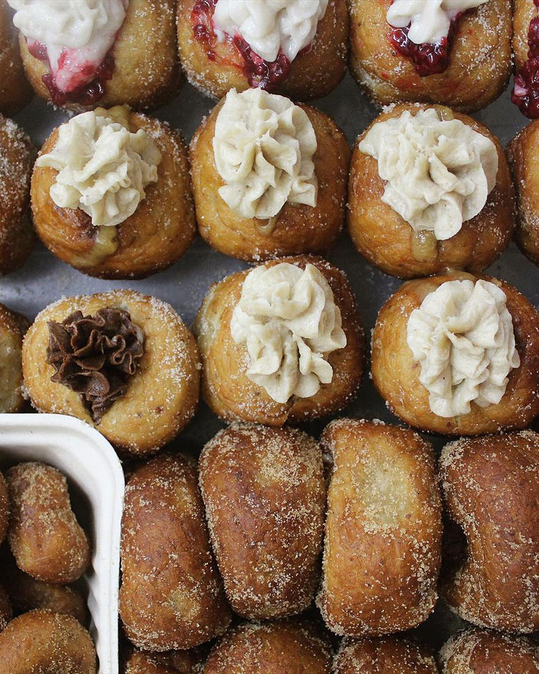 Doughnuts, doughnuts everywhere. Filled with vanilla cream and other delectable fillings. 