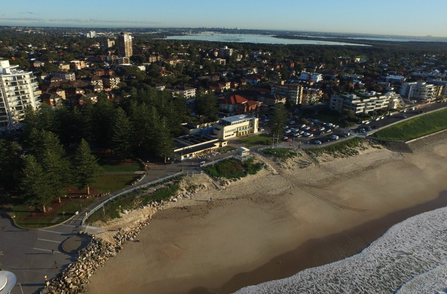 Birds eye view of North Cronulla Surf Lifesaving Club and surrounding landscape