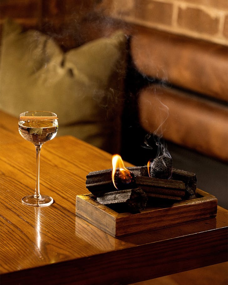 nel restaurant charcoal chips and a martini collaboration with forged by vow