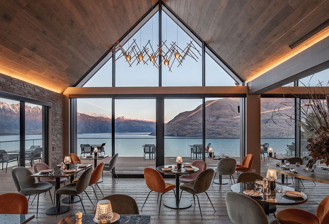 A restaurant overlooking turquoise water in NZ. 