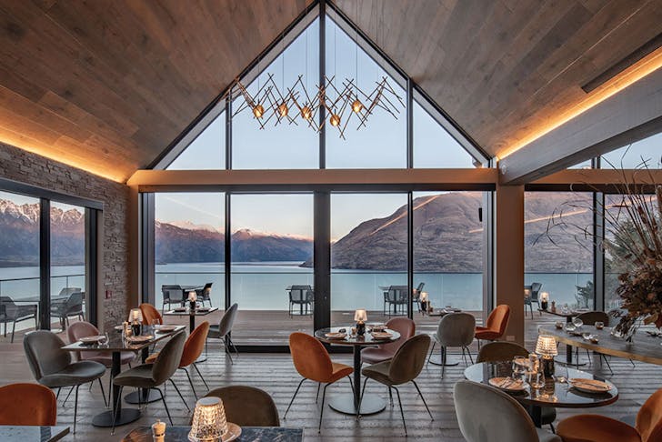 A restaurant overlooking turquoise water in NZ. 