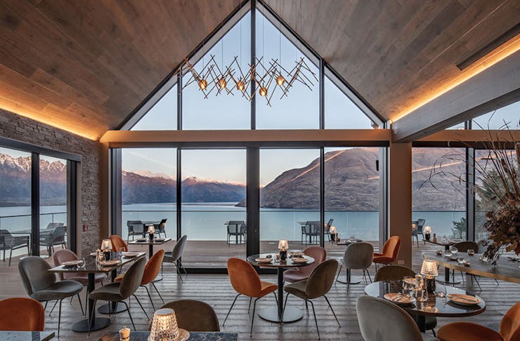 A restaurant overlooking turquoise water in NZ. 