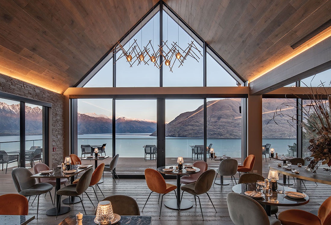 A restaurant overlooking turquoise water in NZ. 