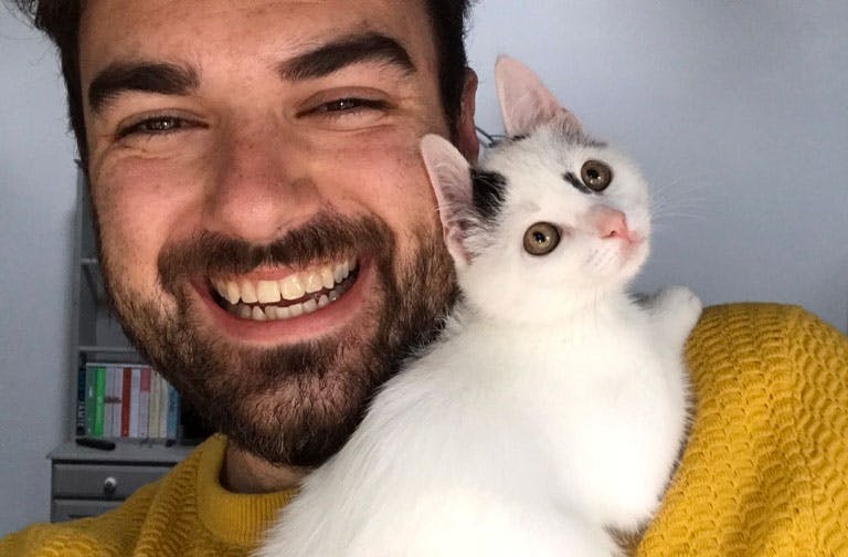 Happy pet parent with a new kitten