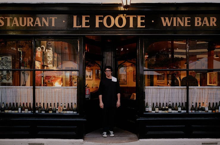 A person stands out the front of Le Foote restaurant in Sydney