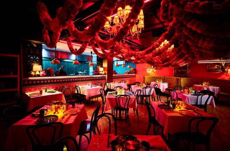 The neon bright interior of Pinky Ji, a new restaurant in Sydney