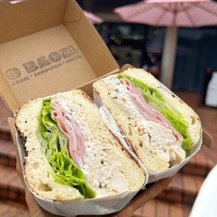 a bagel in a takeaway box