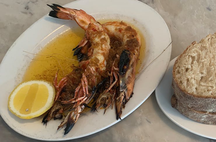 a plate of prawns and bread