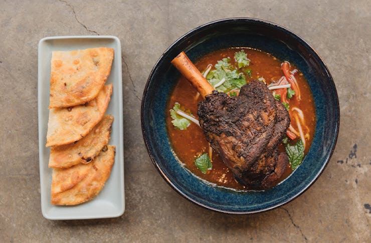 a lamb shank curry with flatbread