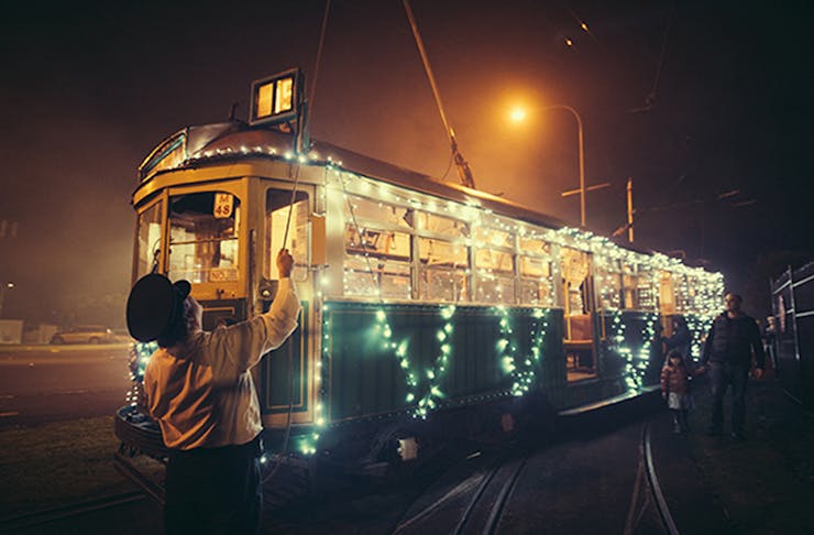 A tram covered in fairy lights.