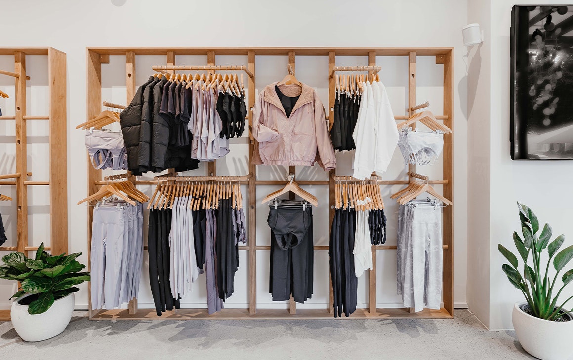 a wall of clothes racks