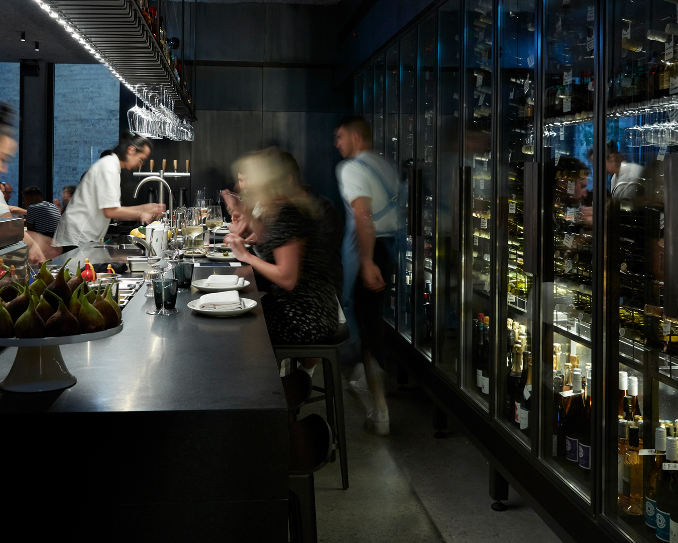People sit at the bar at Beau - a new restaurant in Sydney