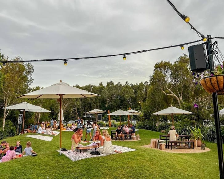 Groups picnic on the grass at North Byron Hotel
