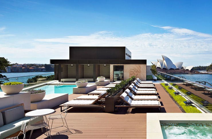 The rooftop pool at the Park Hyatt with Sydney Harbour in the background. 