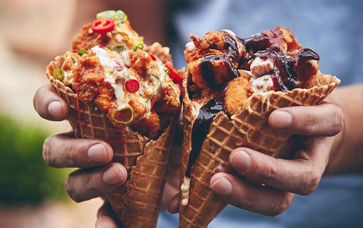two waffle cones filled with chicken
