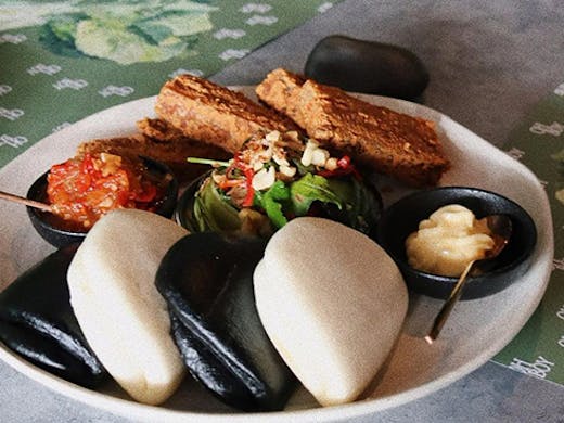 bao buns and fillings on a plate