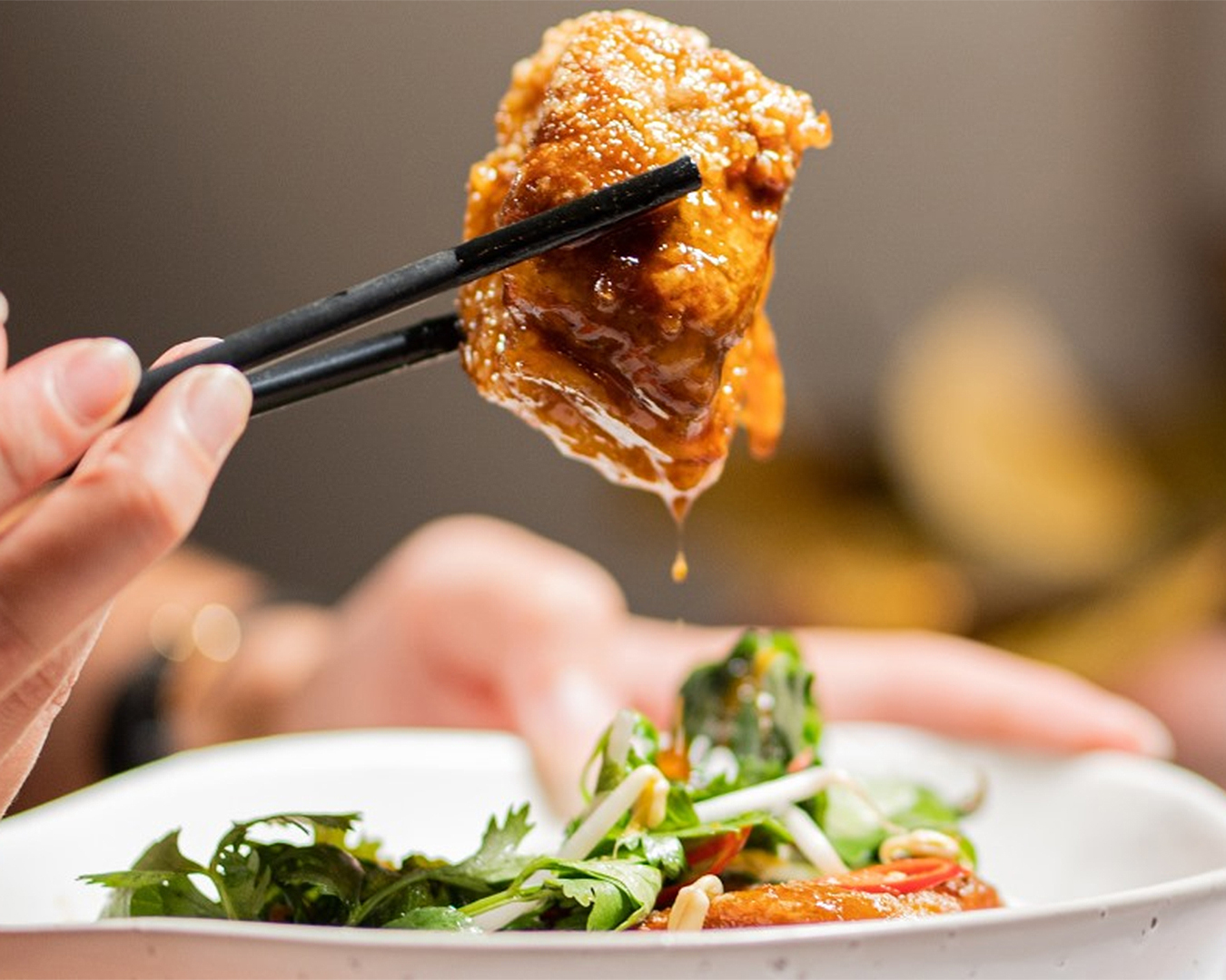 Caramelised pork belly? Paired with fragrant herb salad and crackling dumplings.