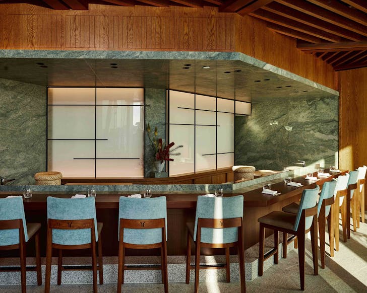 the intimate and cool-tone dining room at yoshii's omakase