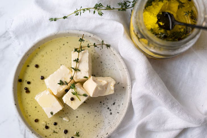 A plate of feta cheese with olive oil