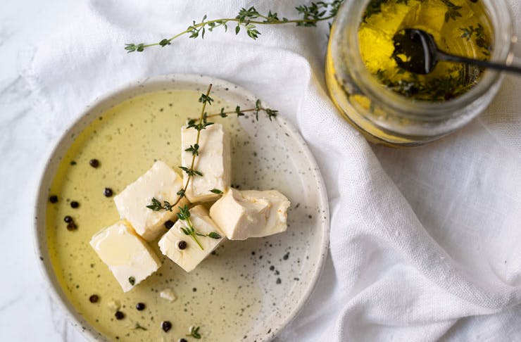 A plate of feta cheese with olive oil