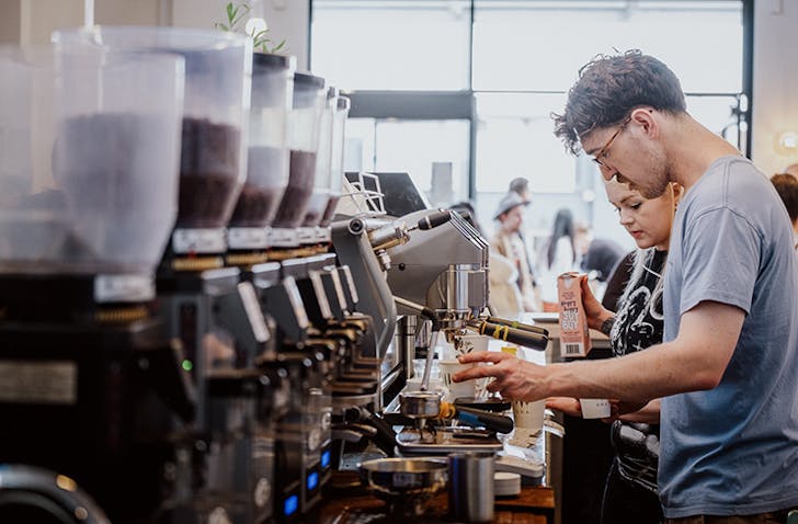 A barista making the best coffee in Melbourne for 2023.