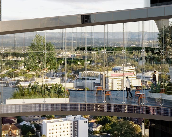 Glass skybridge with greenery and seating connecting two modern skyscrapers, offering panoramic city views at 1 Park Lane, Southport.