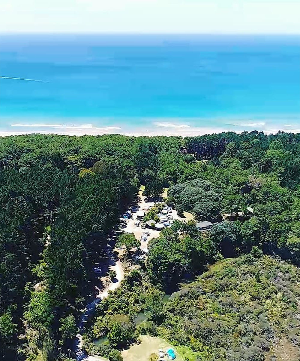 An aerial view of Opoutere Coastal campground in the coromandel.