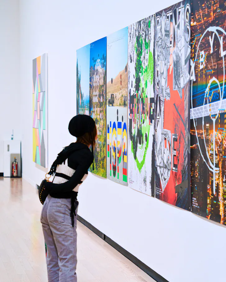 A visitor peering at artwork in a gallery on Osaka's museum island.