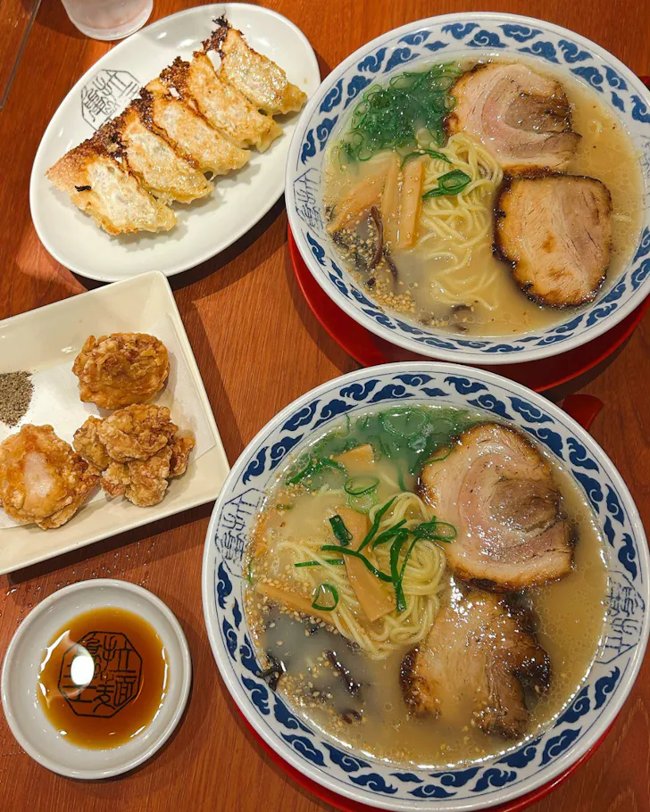Two bowls of ramen and dumplings on the table at Ramen Kio Osaka.