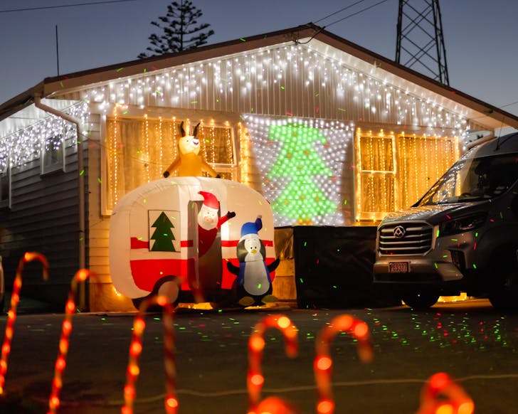 A colourful couple of houses light up for Christmas.