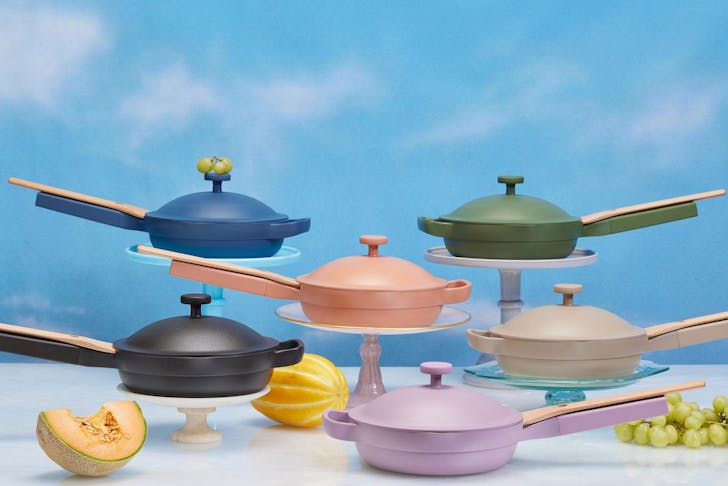 A range of coloured pans from Our Place Cookwear
