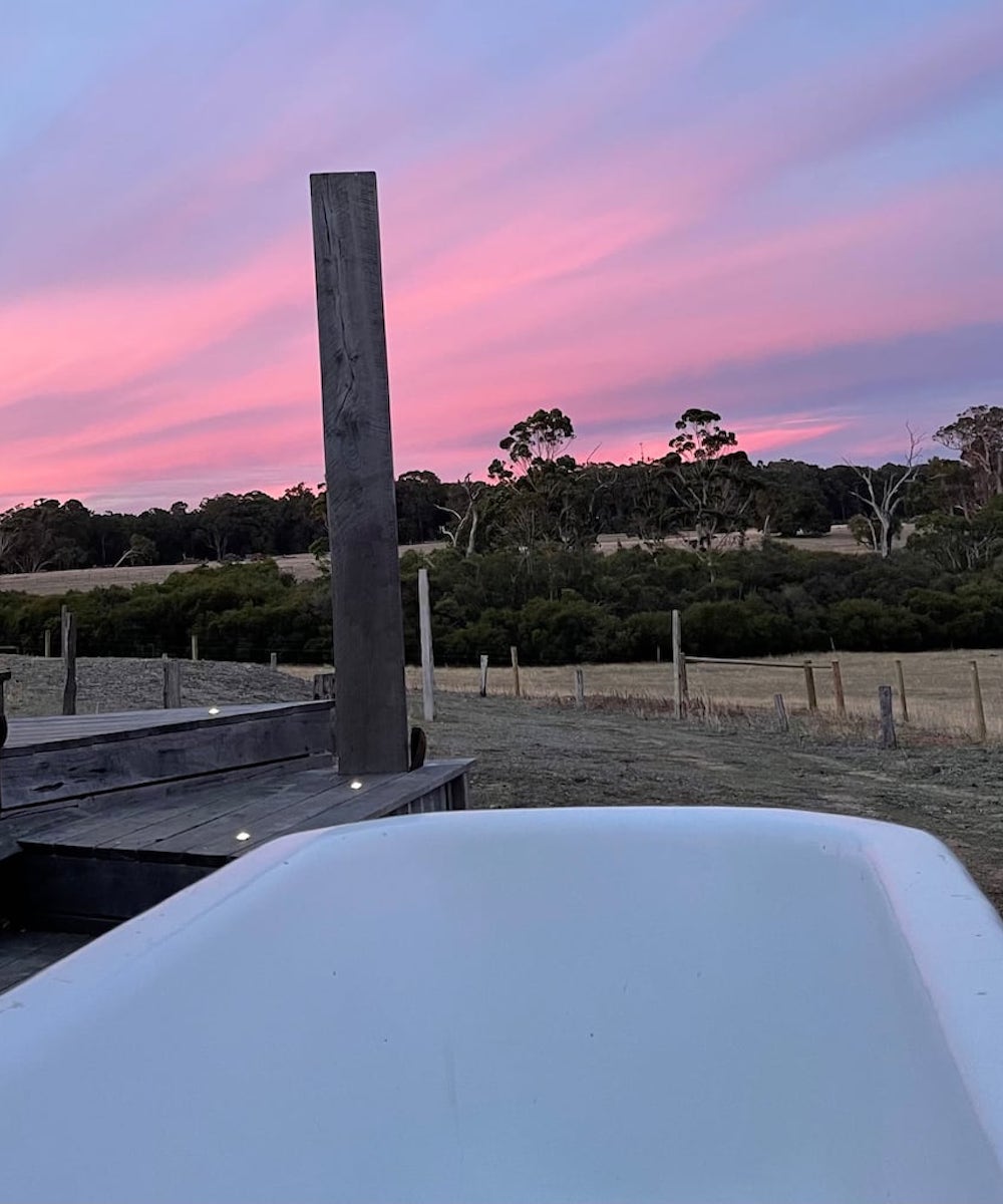 An outdoor bath at sunset