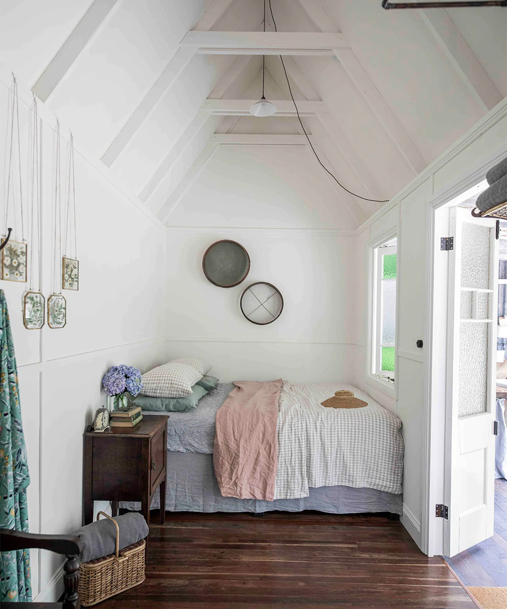 bed against a wall in a small cabin